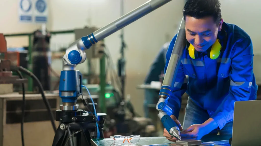 Engineer inspecting precision injection mold tooling for plastics production.